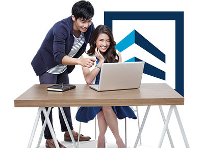 Couple working on laptop at desk